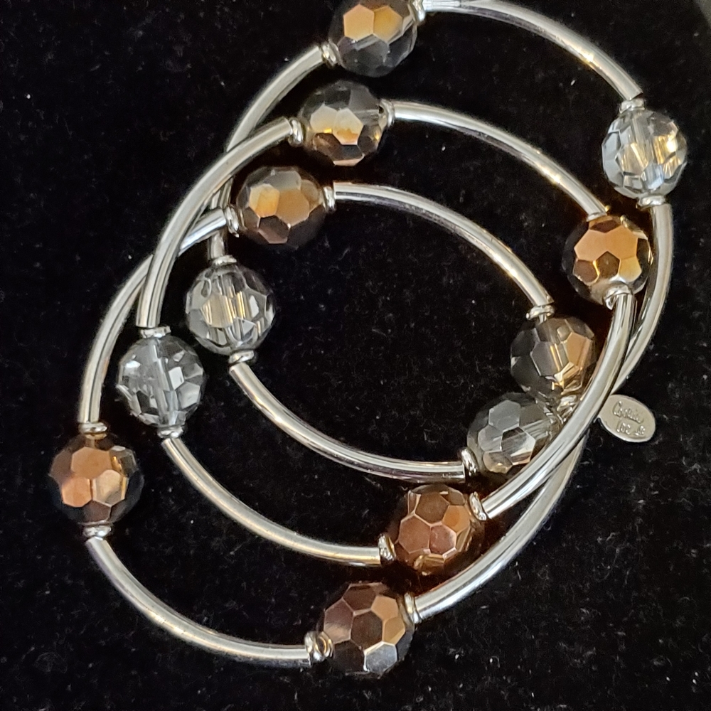 Cookie Lee set of three silvertone stretch bracelets with shiny beads